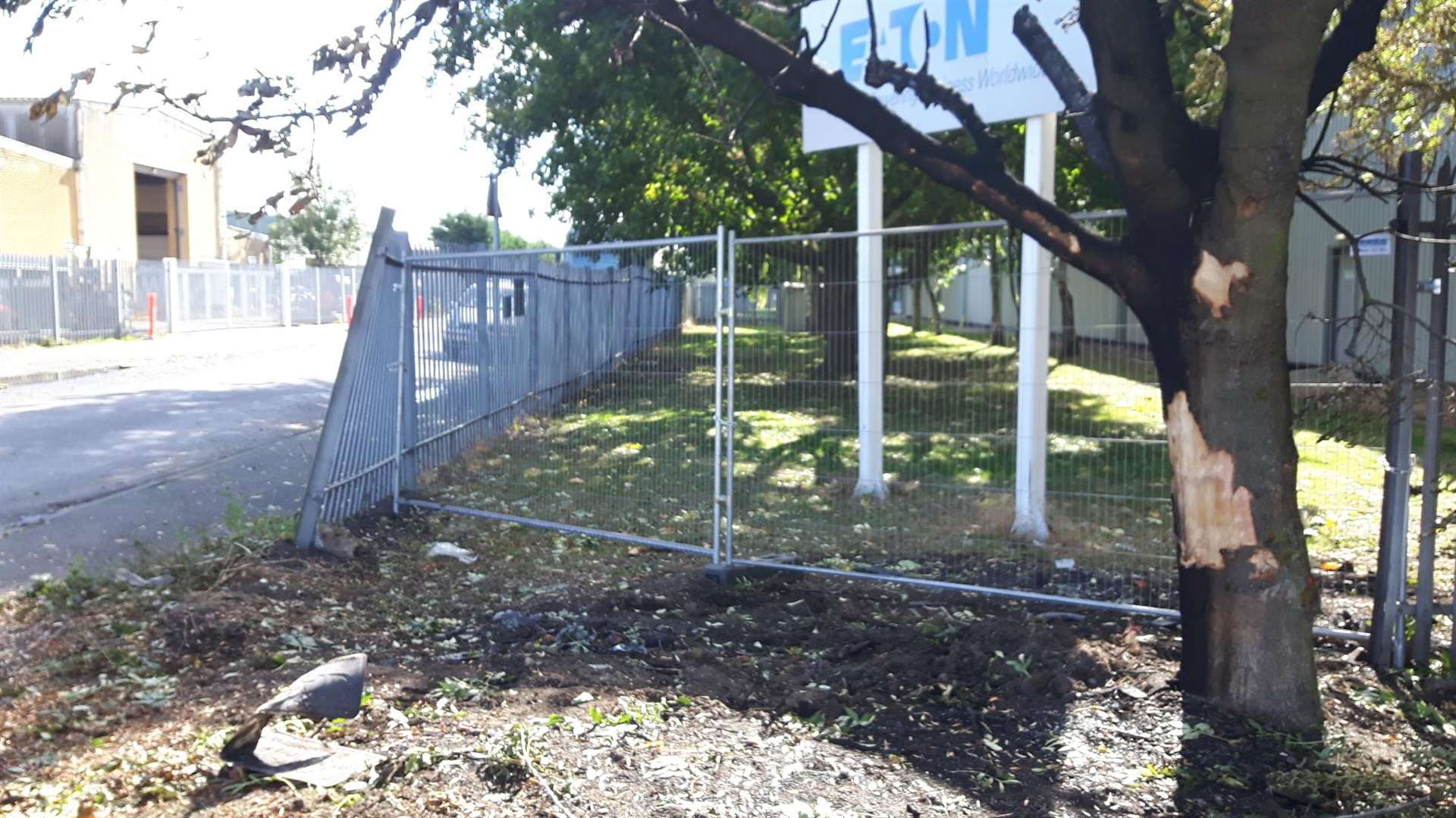 The car left the road, hit a tree and crashed through a fence