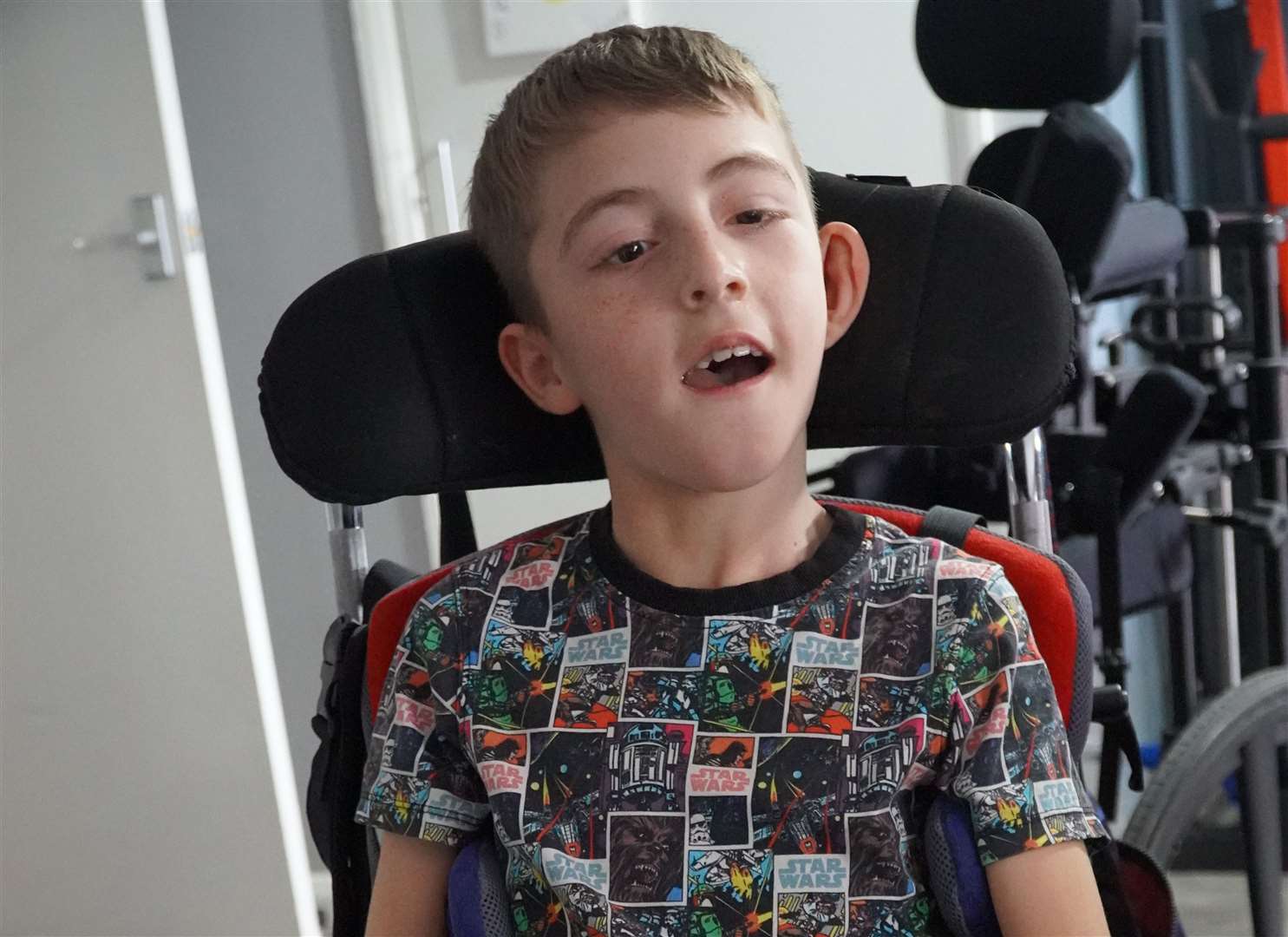 Tomas Powell, 11, is dependent on a wheelchair and a walker because of Pelizaeus Merzbacher disease