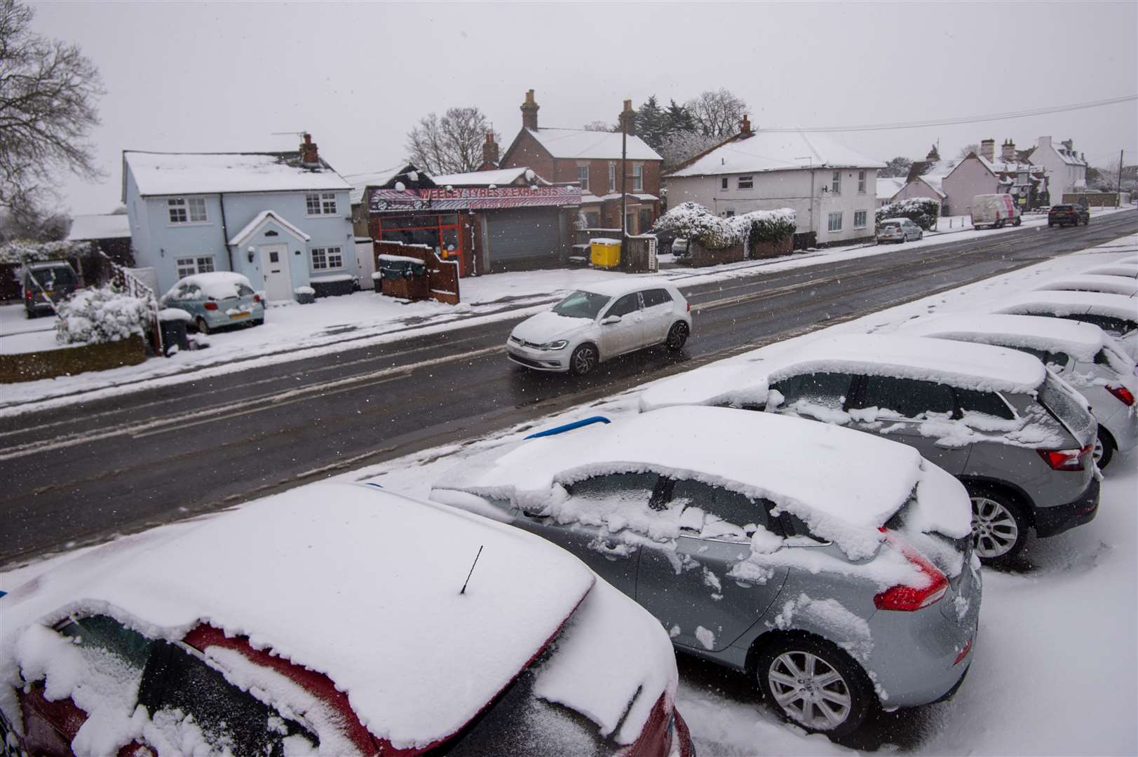 Cars covered in snow at a car dealership in Weeley in Essex (Joe Giddens/PA)