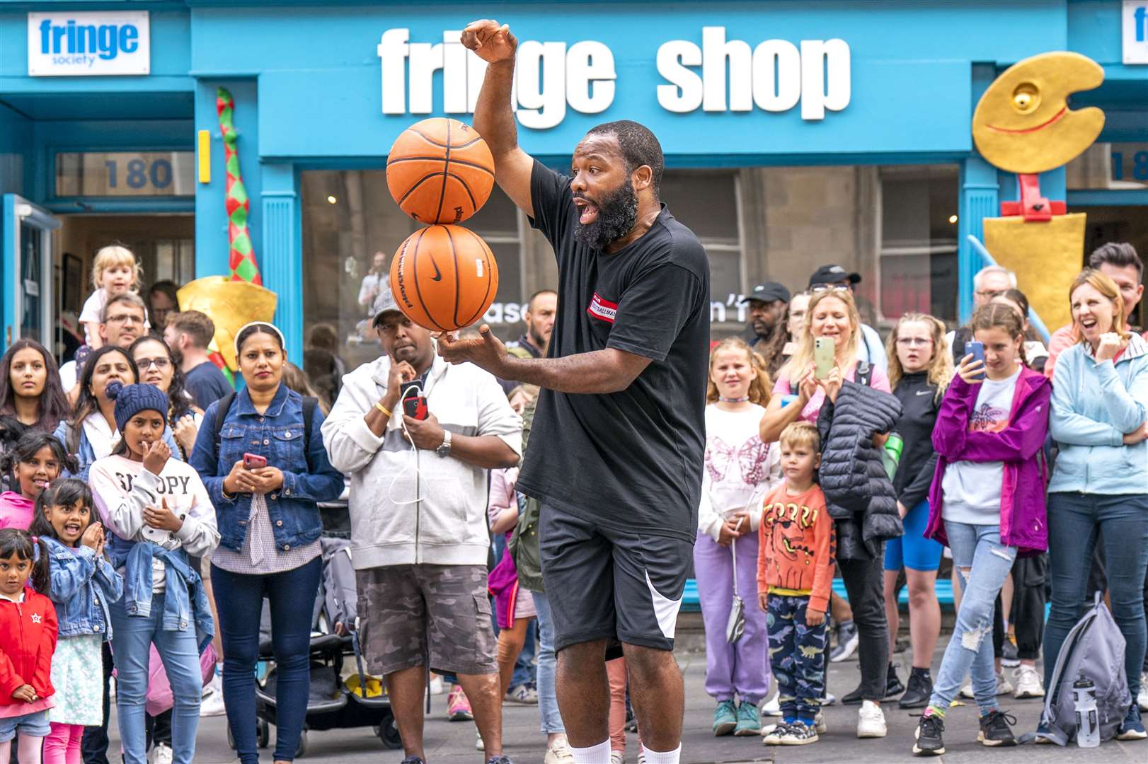 Circus street artist BasketballMan performs for the crowds on the Royal Mile, Edinburgh (Jane Barlow/PA)