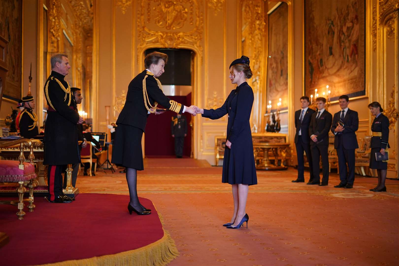 Madeleine Davidson-Houston received the Queen’s Gallantry Medal from the Princess Royal on behalf of her late grandfather, John Rees, who intervened in an armed attack at a supermarket in 2020 (Yui Mok/PA)