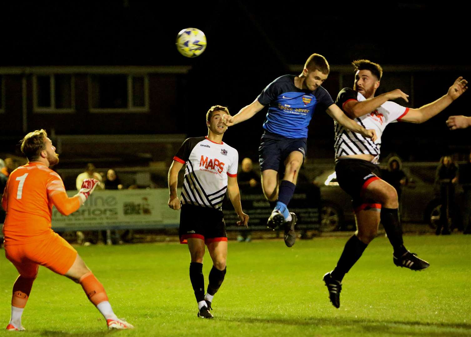Deal striker Connor Coyne sends a header looping over Faversham Strike Force goalkeeper Harry Earls for their third in last Tuesday’s 8-2 Challenge Cup win. Picture: Paul Willmott