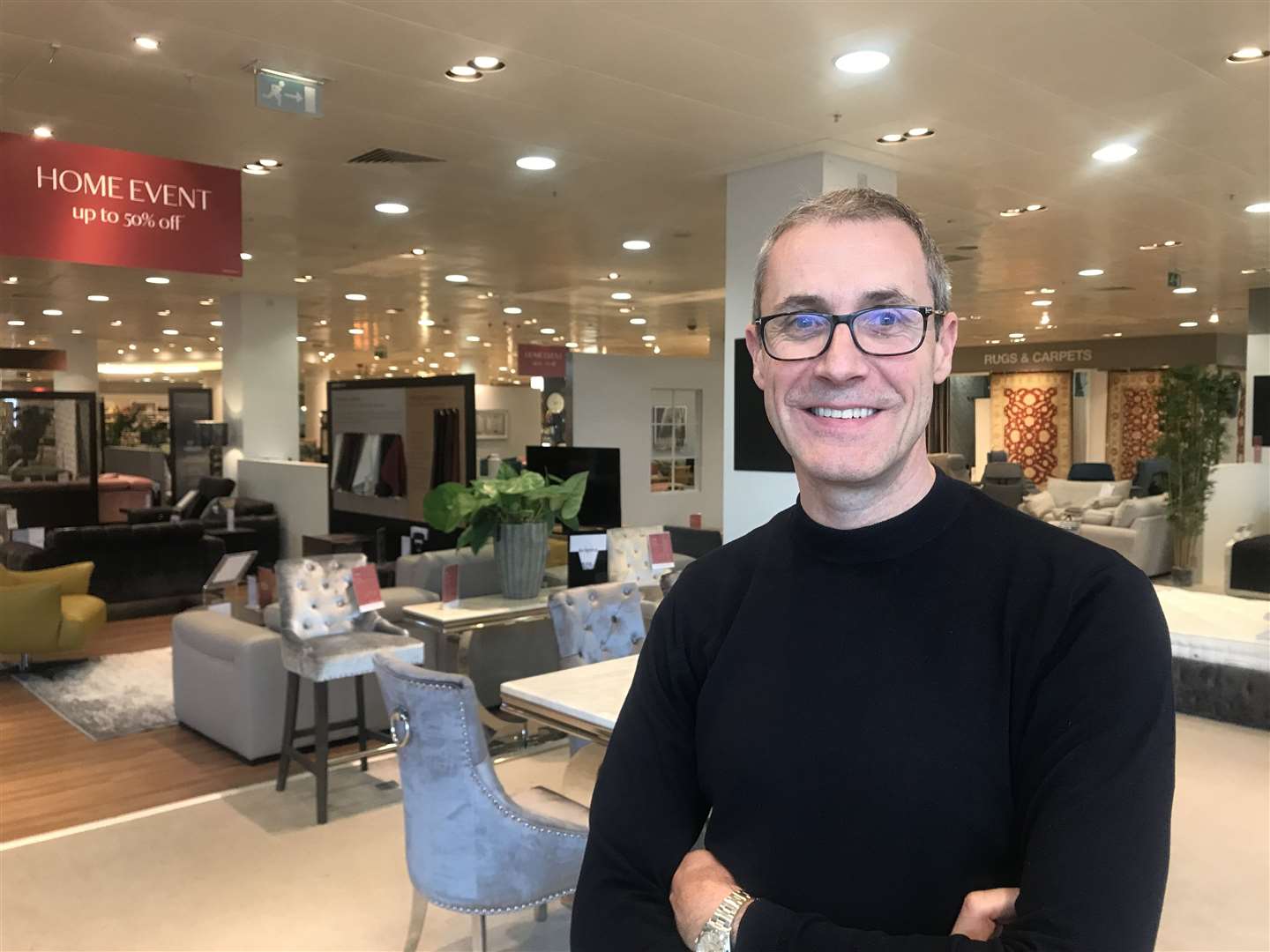 Simon Youden standing on the shop's empty top floor