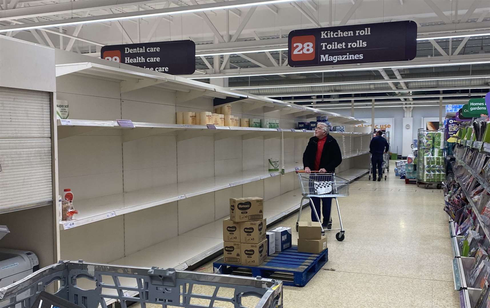 A shopper at Sainsbury's searches for products