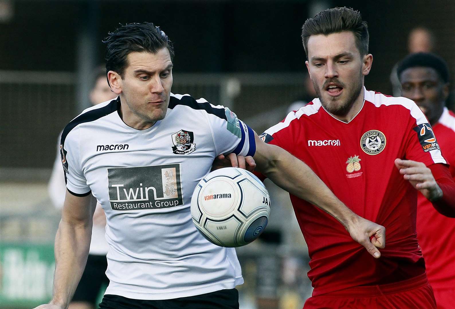 Dartford captain Tom Bonner gets to grips with his man Picture: Sean Aidan