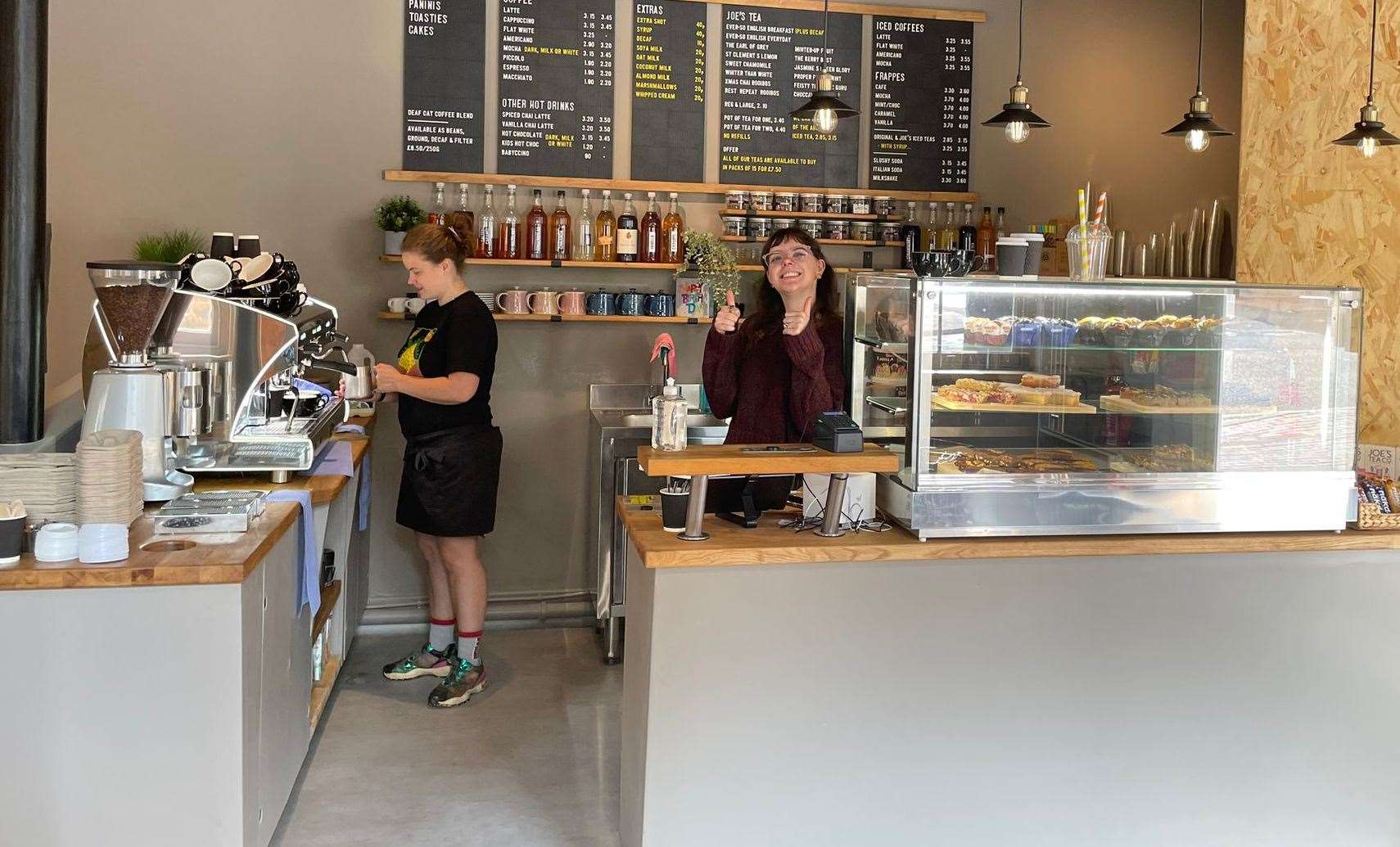 Staff serving up treats at Deaf Cat Coffee Maidstone