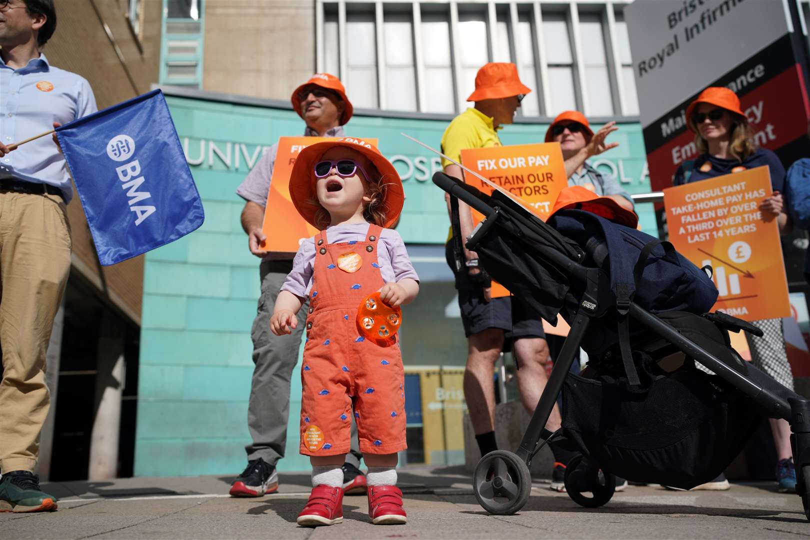 One-year-old Edith joined medical consultant members of the British Medical Association on the picket line outside Bristol Royal Infirmary (Ben Birchall/PA)