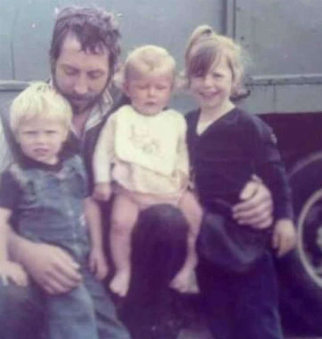 A young Maryann with her father and siblings