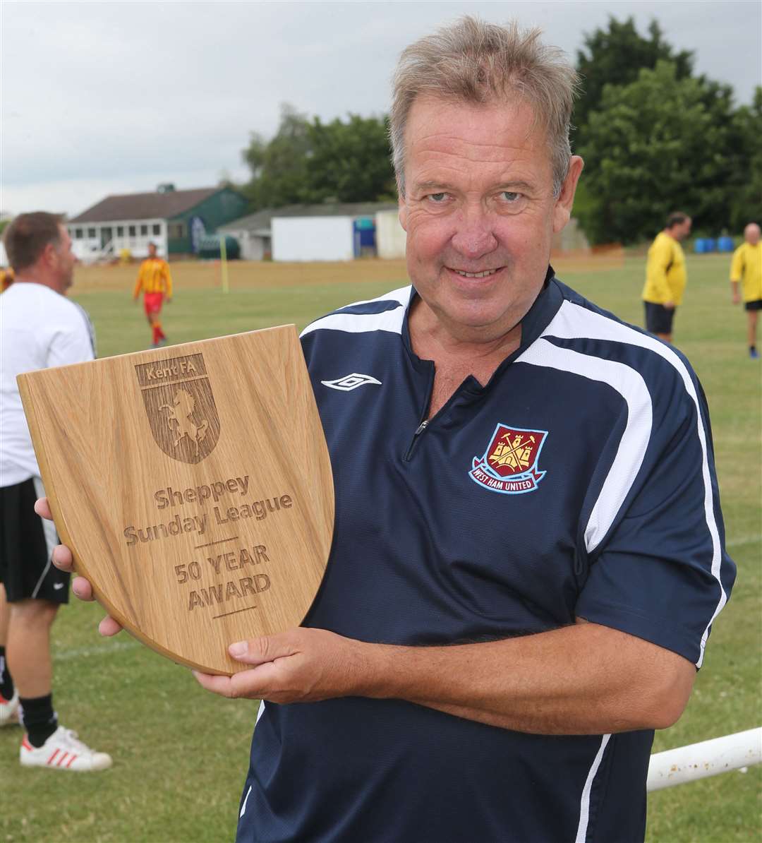 Mark Rogers with the Sheppey Sunday League's 50-year award from the Kent FA in 2017. Picture: John Westhrop