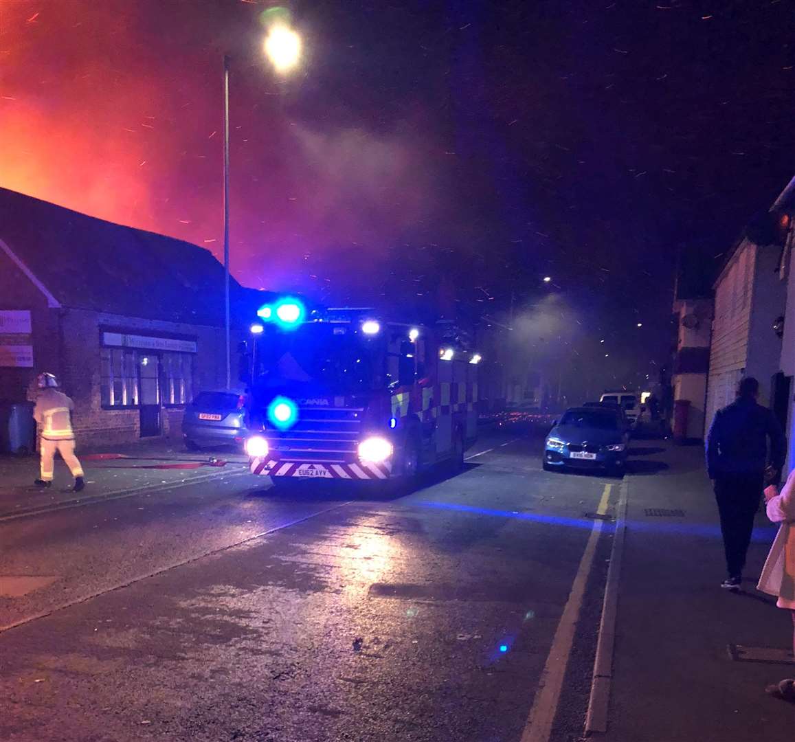Firefighters arrive to tackle the fire at FJ Williams joinery in London Road, Teynham. Picture: Paul Mercer (5309077)