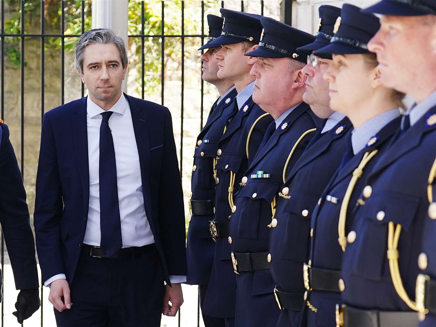 Simon Harris (left) arriving for a ceremony to award deceased, retired and serving members of An Garda Siochana with bravery medals (Brian Lawless/PA)