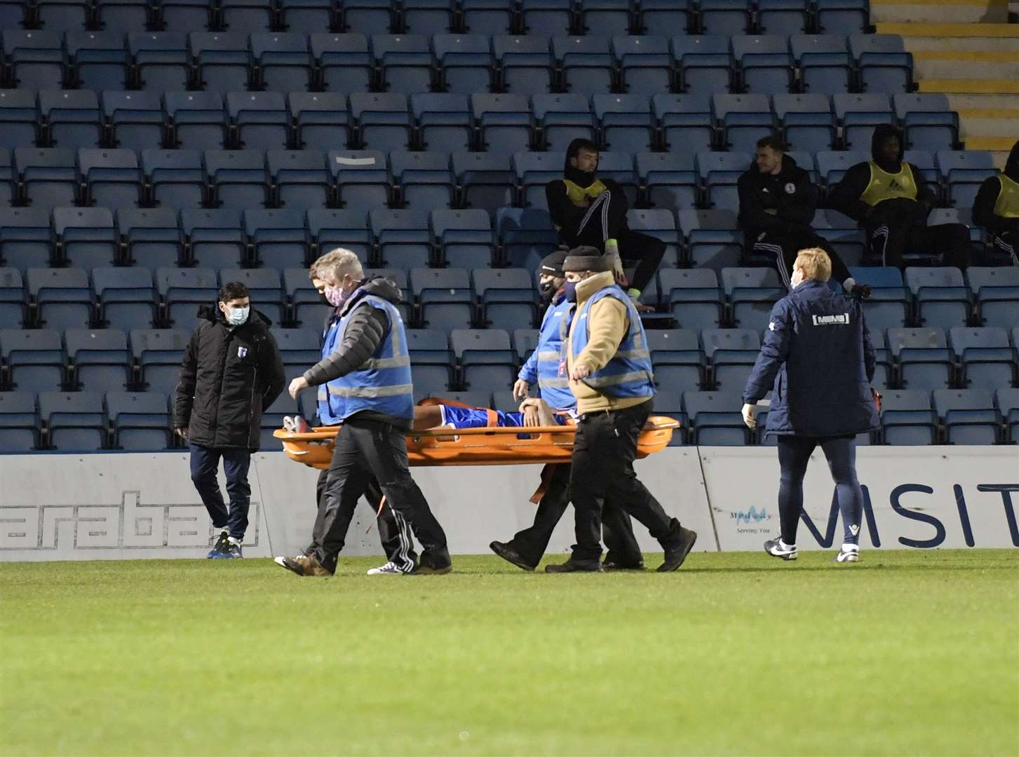 Striker Dominic Samuel is stretchered off Picture: Barry Goodwin