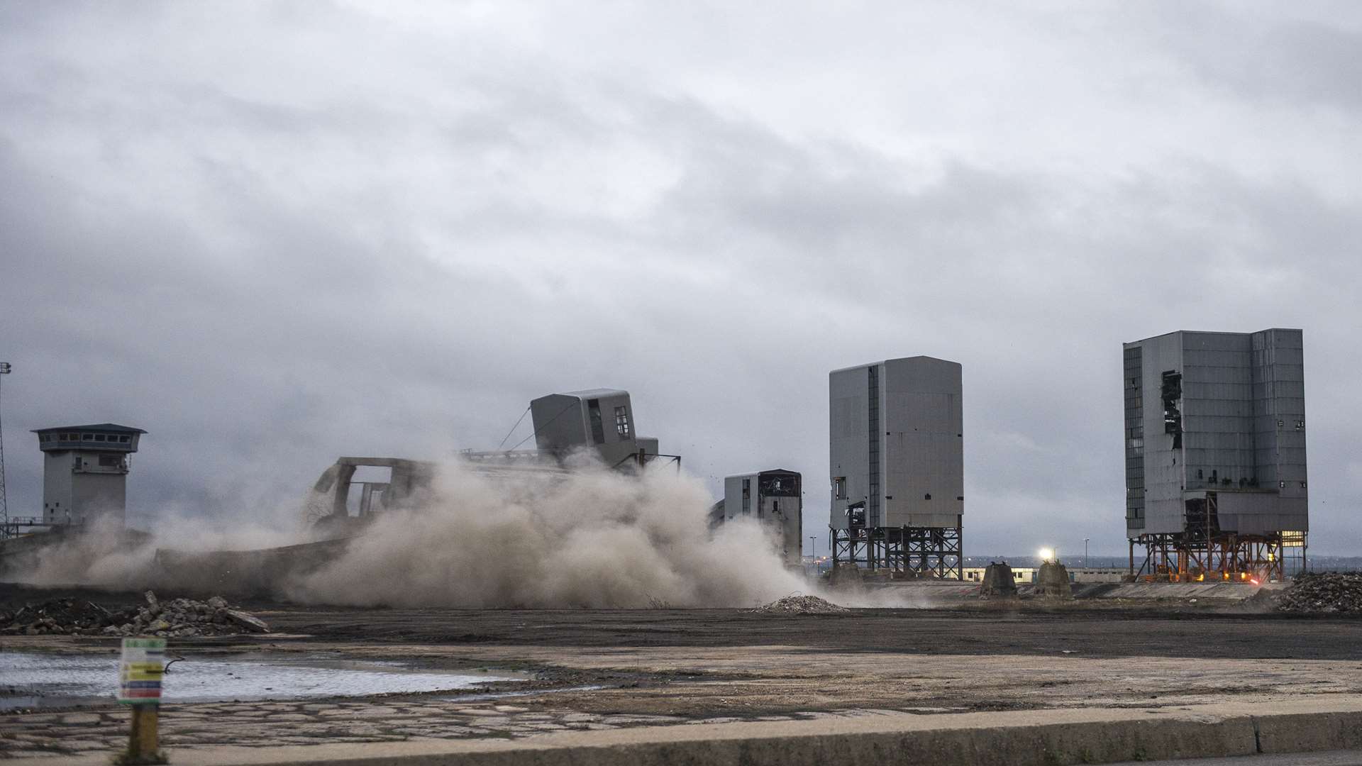 Debris is seen flying from the building at Kingsnorth