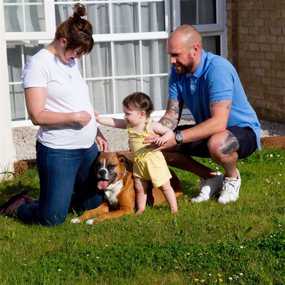 Funeral director Gray Reigate, pictured with wife Zoe, daughter Molly and Boris the boxer Photo: Strawberry Photography