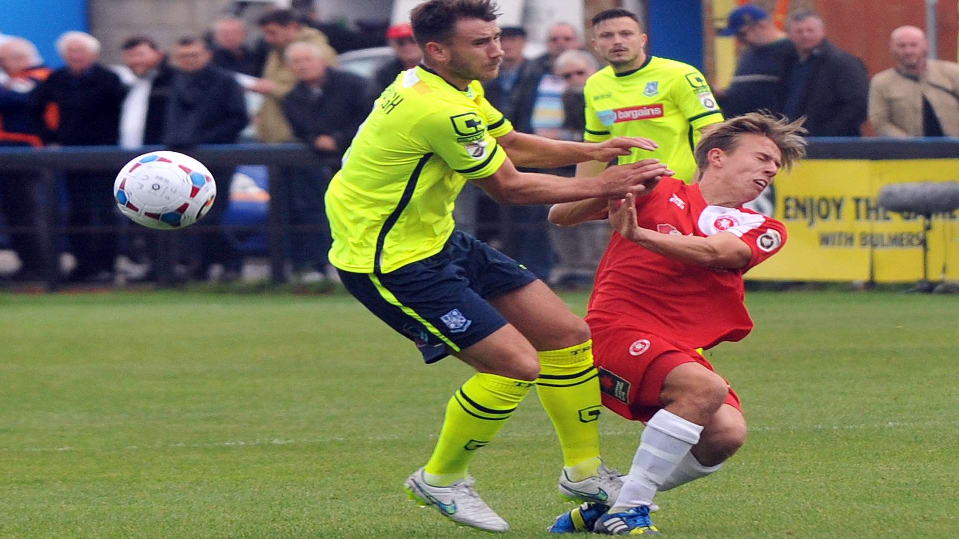 Sam Corne feels the full force of this Tranmere challenge. Picture; David Brown