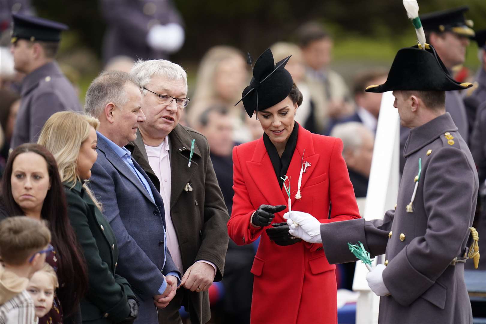 The Princess of Wales presents leeks to members of the public during the St David’s Day visit (Andrew Matthews/PA)