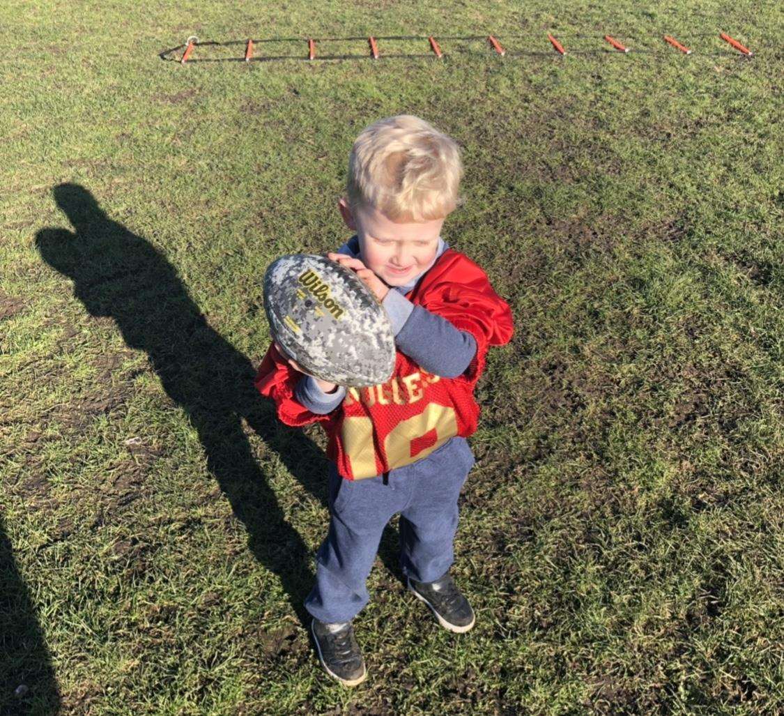 Jason Wilson's four-year-old son Jamie is learning the game