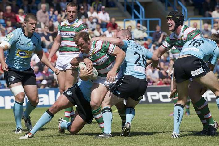 London Broncos struggle to contain another Warrington Wolves attack during the game at Priestfield Stadium in June