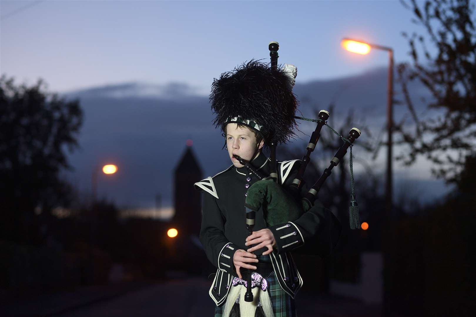 George Orchin, 12, plays for the healthcare workers on his street (Michael Cooper/PA)