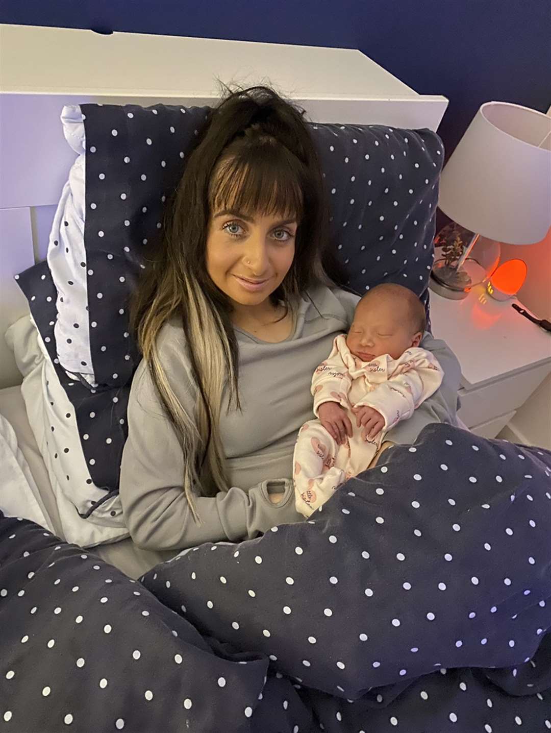 Bryony holding her baby sister Murron (Stephanie Duthie/PA)