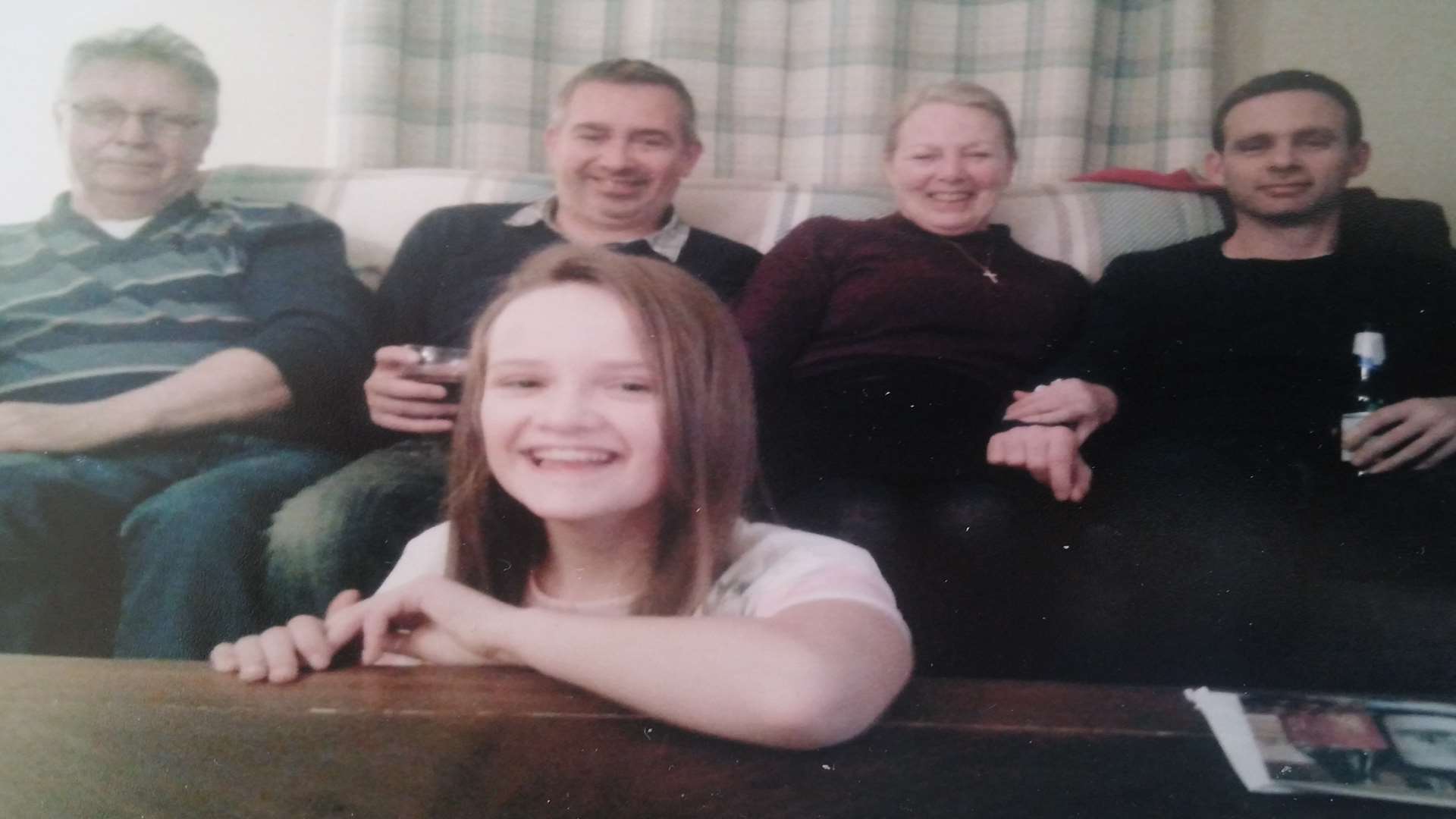 Layla pictured with dad Colin, right, mum Rita and brother Scott during happier times