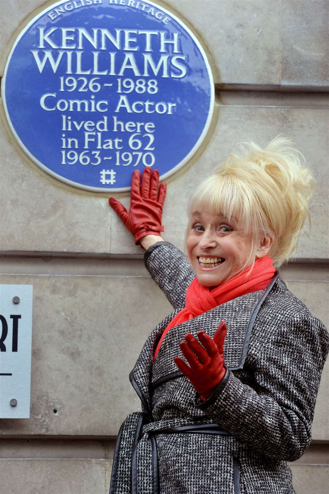 Dame Barbara next to an English Heritage blue plaque for her Carry On co-star Kenneth Williams (John Stillwell/PA)