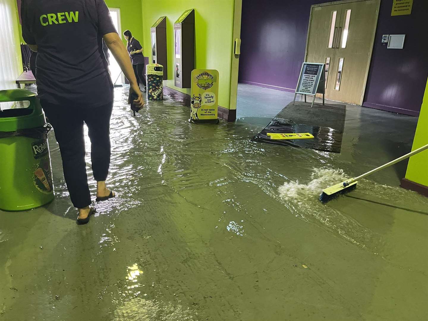 Staff at The Milky Way adventure park in Devon clear out floodwater (Steff Gaulter/PA)