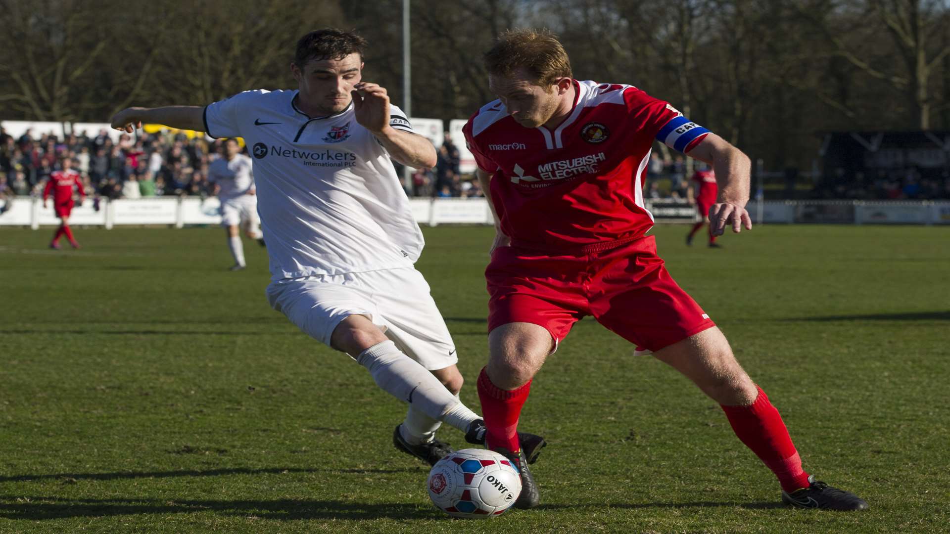 Rival captains Danny Waldren and Stuart Lewis battle it out in midfield Picture: Andy Payton