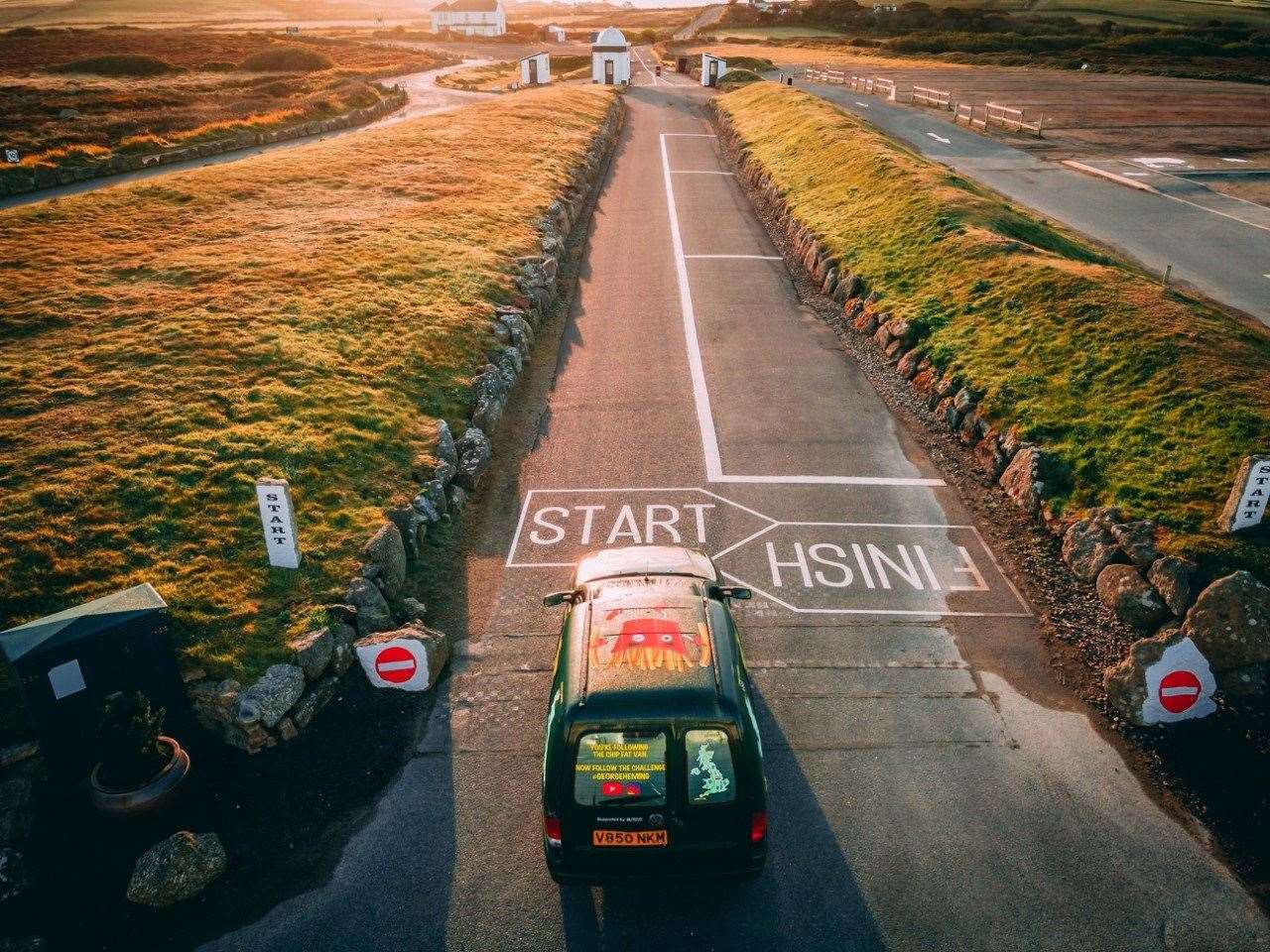 They're off - George and James Heming set off in their chip fat fuelled van. Photo SWNS (49152482)