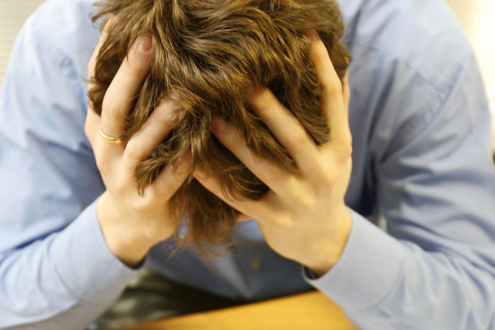 Russell pulling his hair out sitting over statements and credit cards. Stock picture