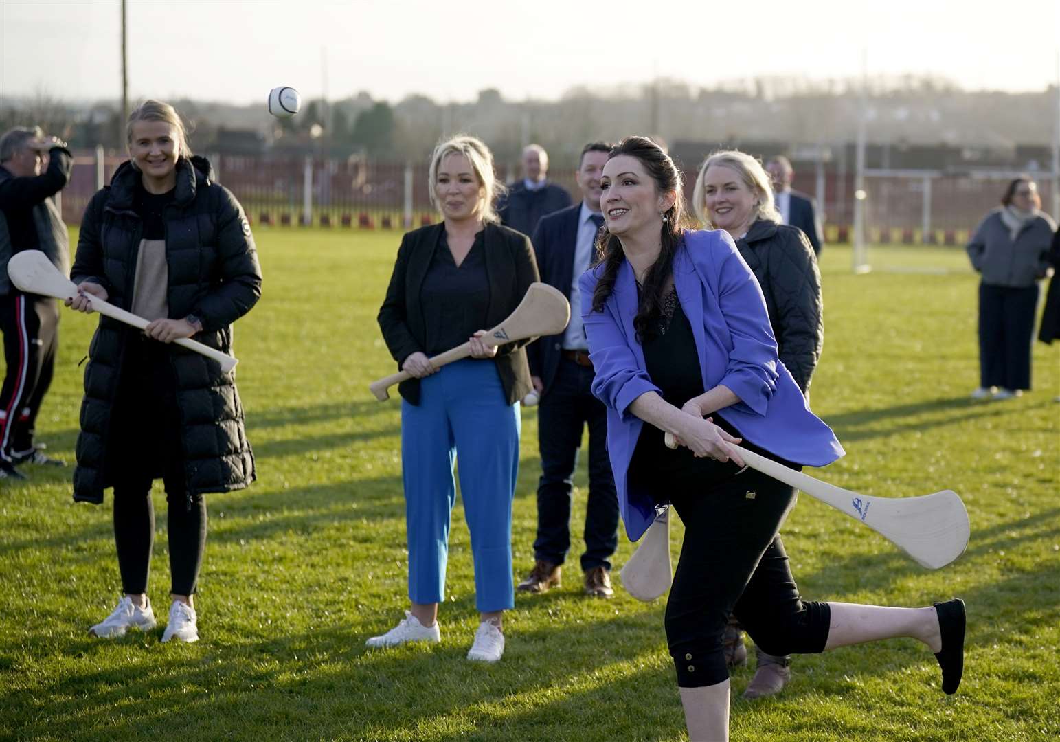 Northern Ireland First Minister Michelle O’Neill (centre), deputy First Minister Emma Little-Pengelly (right), and junior minister Aisling Reilly (left) visit St Paul’s GAA club in west Belfast (Niall Carson/PA)