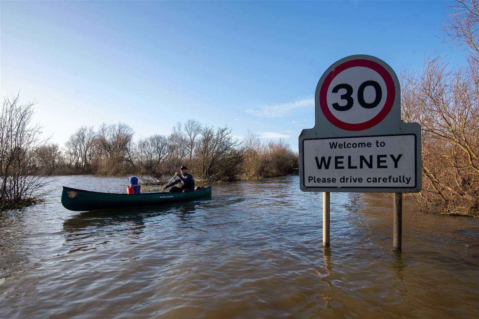 In Norfolk, the flooded A1101 in Welney was passable only by boat (Joe Giddens/PA)