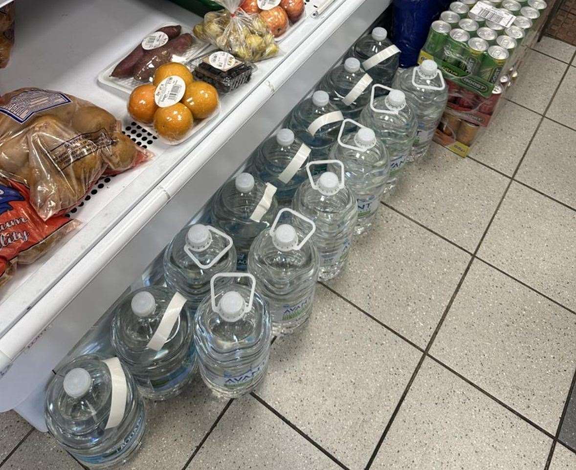 Shopkeeper Visvalingam Puvanachandran has ridiculed the hygiene inspector's instruction not to store drinks on the floor. Photo: Ashford Borough Council.