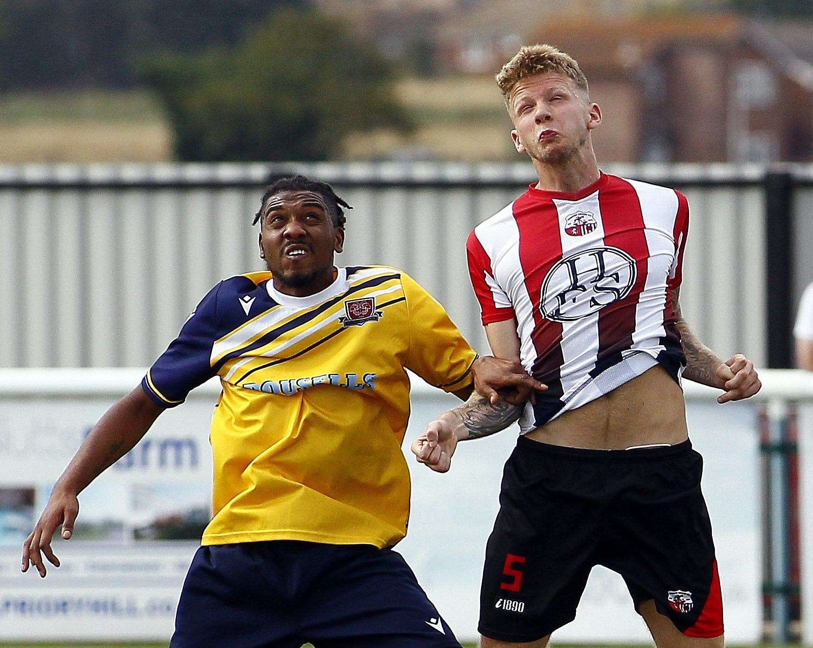 Sheppey defender Jez Hammond, right Picture: Sean Aidan