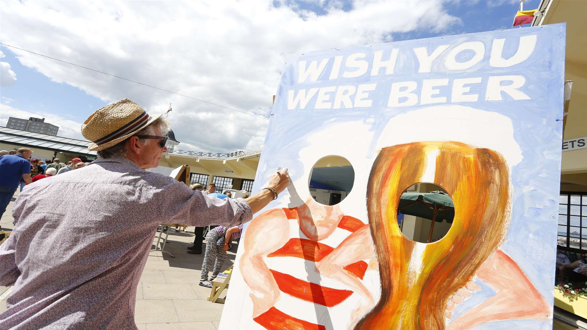 Chris Burke paints at Herne Bay Cartoon Festival last year Picture: Andy Jones