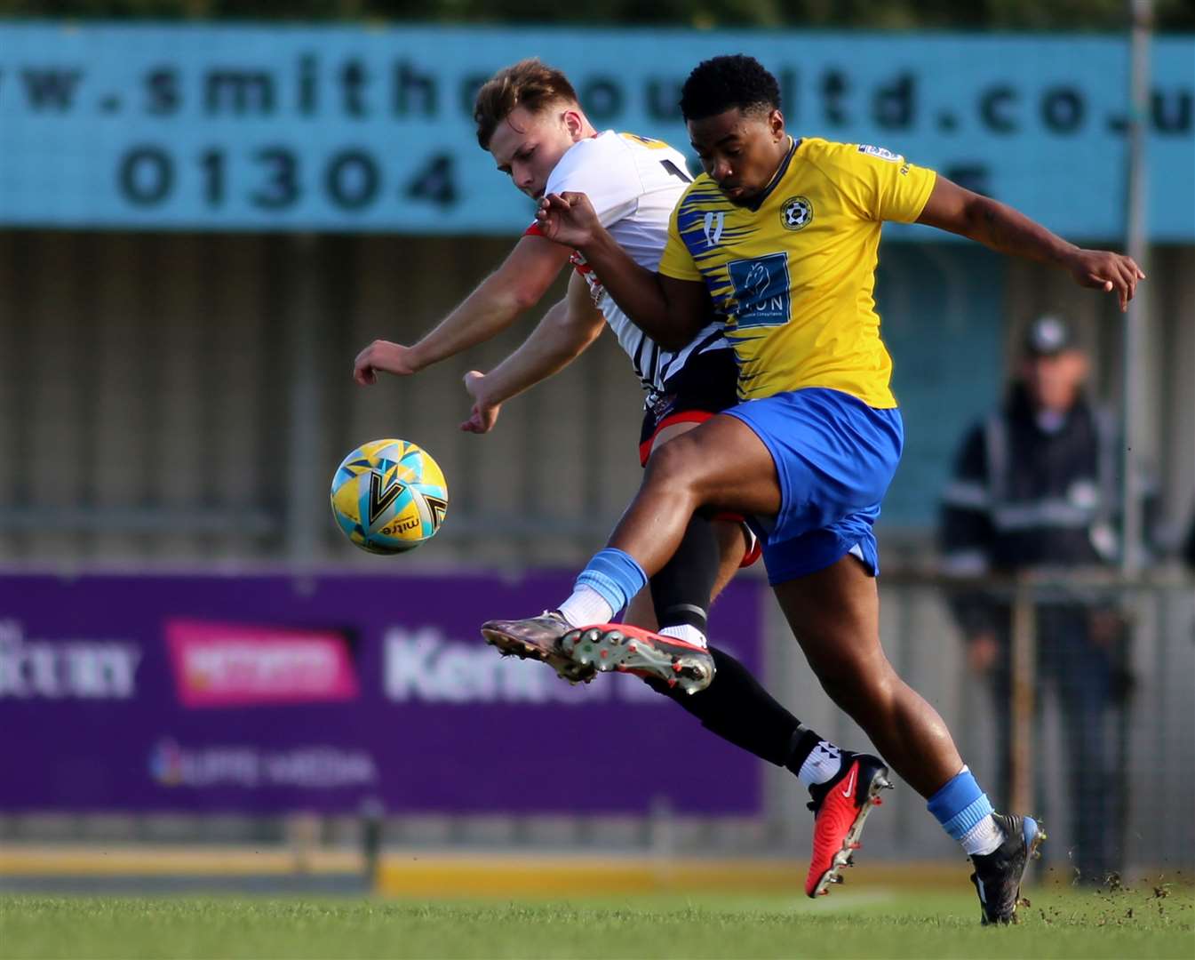 Deal scorer Jack Hanson tussles in midfield with Snodland player Ryan Atkinson. Picture: Paul Willmott