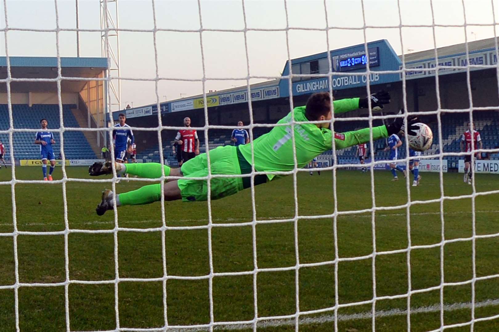 Gillingham keeper Jack Bonham flies into action earlier this season. Picture: Keith Gillard