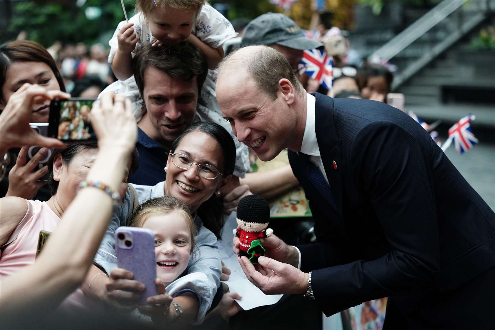 The Prince of Wales greets well-wishers as he arrives at Jewel Changi Airport in Singapore (Jordan Pettitt/PA)