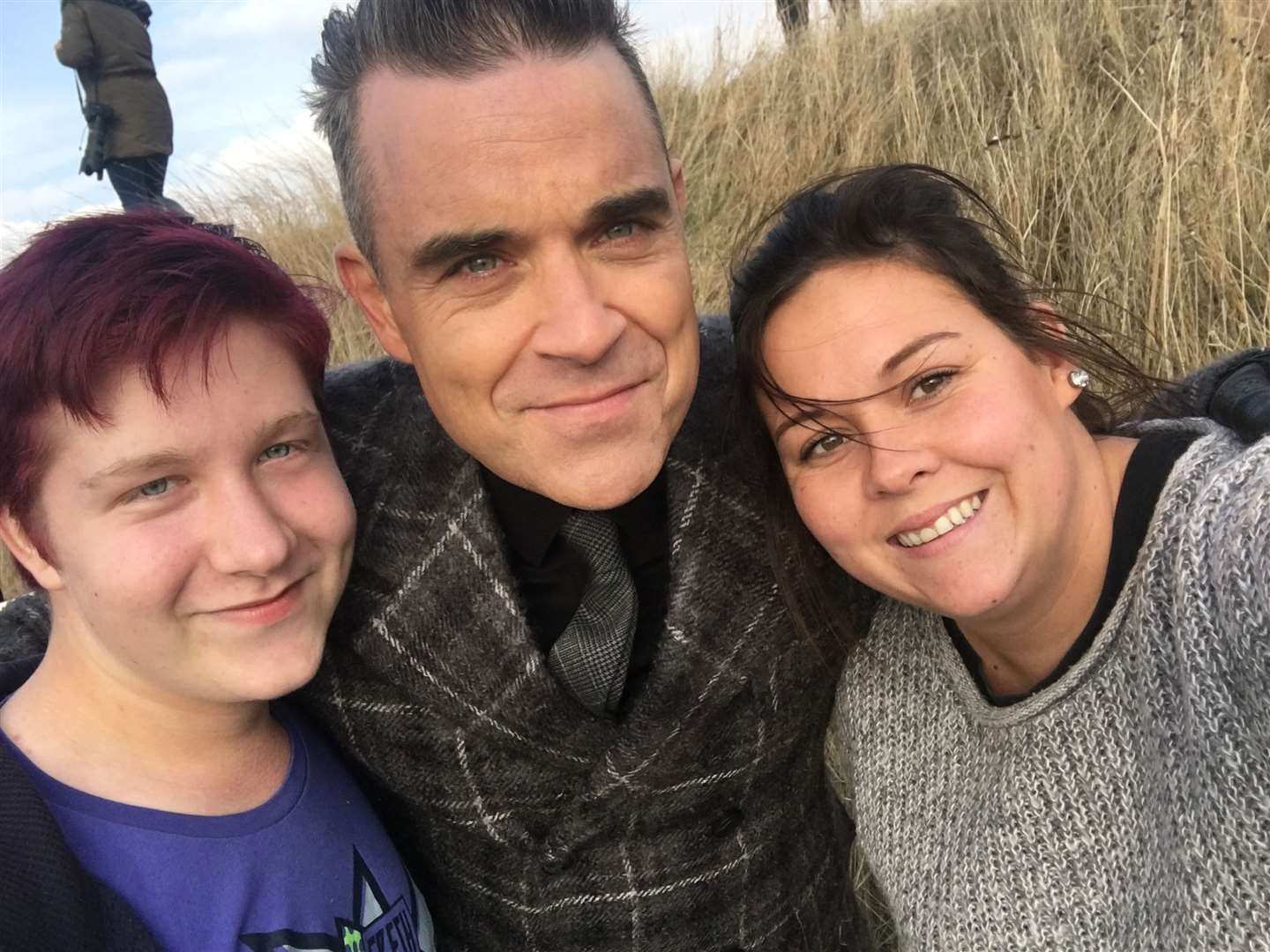 Robbie Williams poses for a selfie with fans Dan Hughes and Sasha Burgoine while filming at Leysdown Picture: Sasha Burgoine