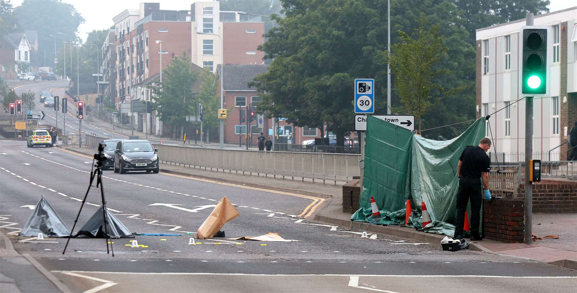 Police at the scene of a crash in New Road, Chatham. Images: UKNiP