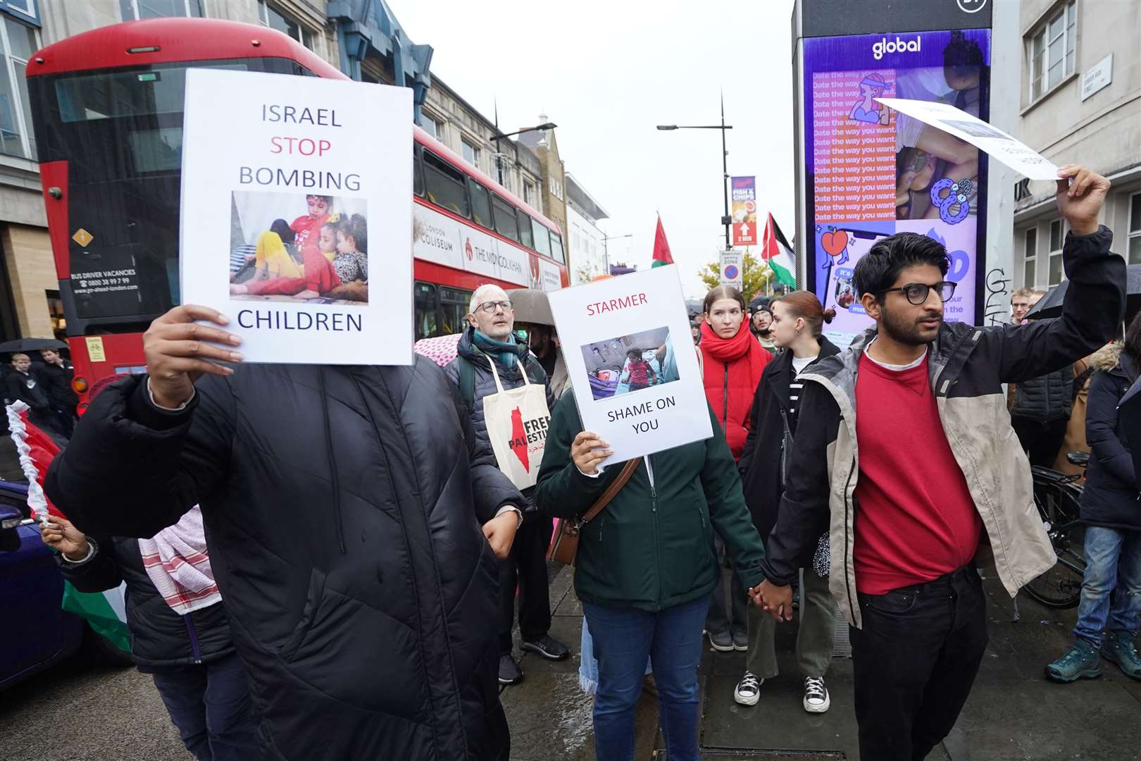 People demonstrate outside the constituency office of Labour Party leader Sir Keir Starmer (Stefan Rousseau/PA)