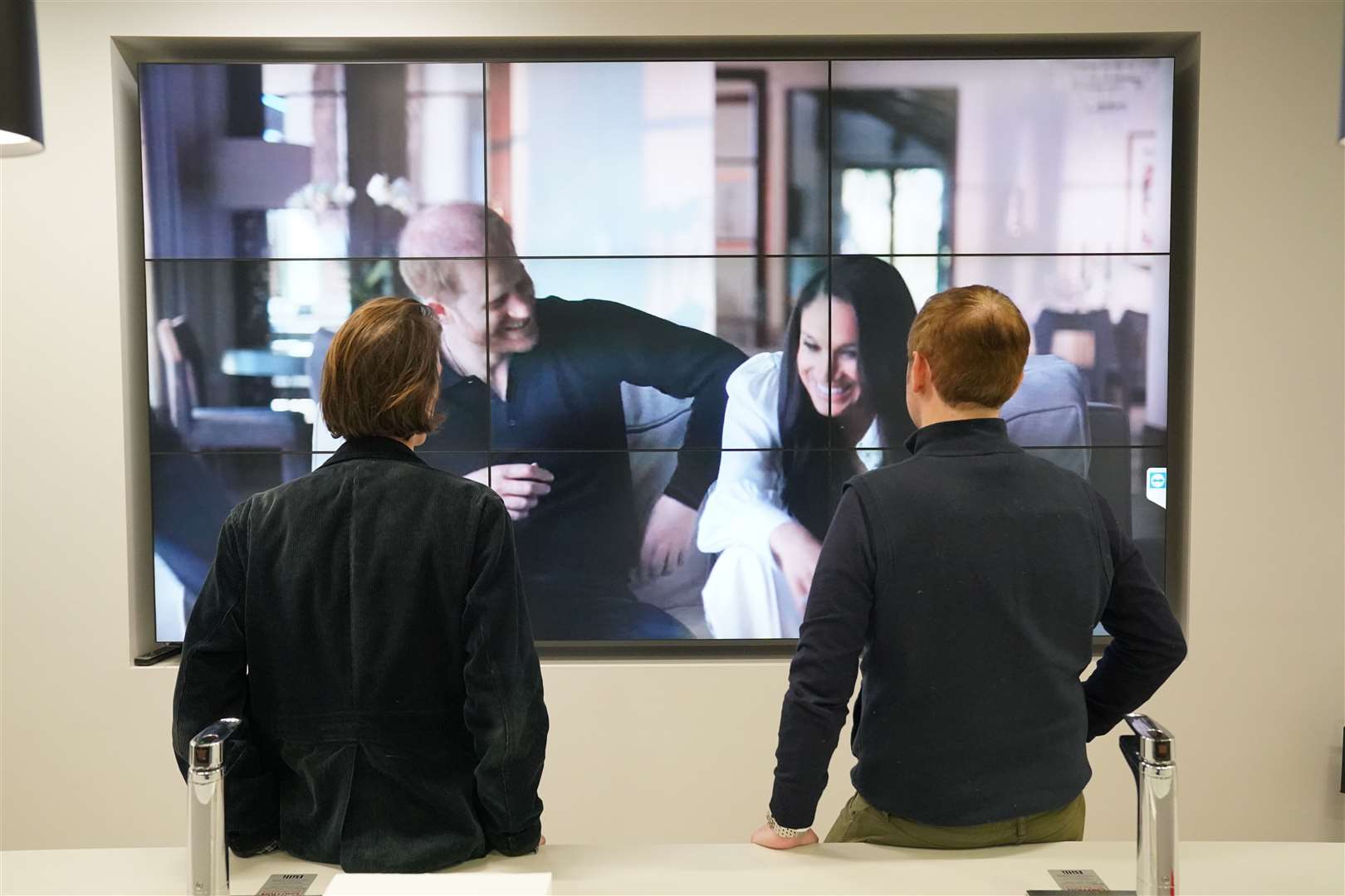 Office workers in London, watching the Duke and Duchess of Sussex’s controversial documentary being aired on Netflix (Jonathan Brady/PA)