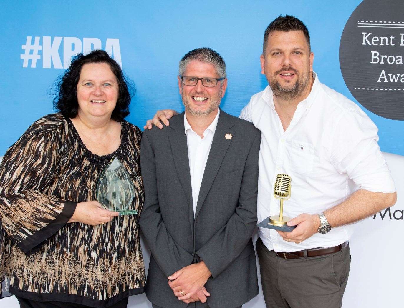 The Golden Microphone award won by kmfm; Juliet Owen and Rob Wills with judge Leo Whitlock (centre). Picture: Tim Stubbings/Maxim