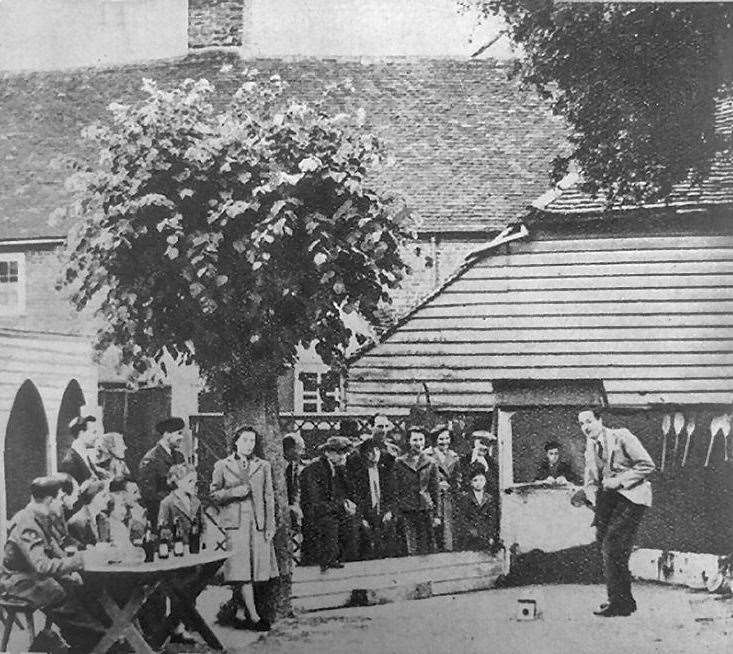 Bat and trap being played at Ye Olde Beverlie pub in Canterbury in 1944. Pic: Rory Kehoe