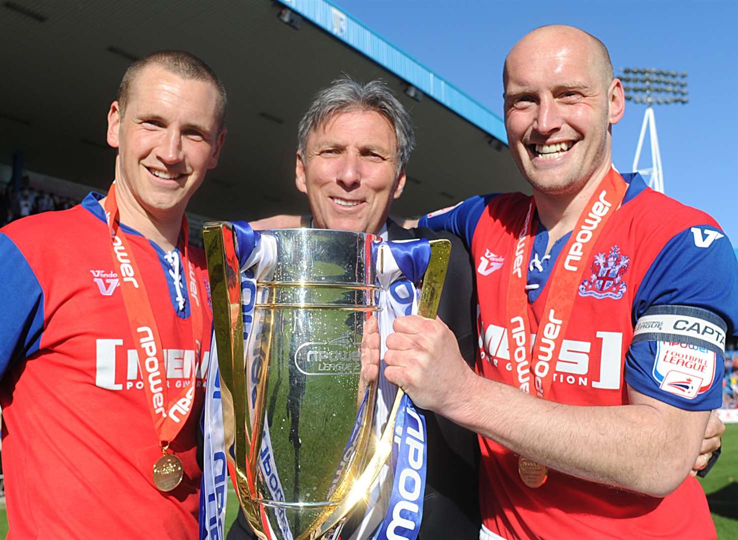 Happier times as Michael Anderson celebrates Gills winning the League 2 title in 2012/13 with Andy Frampton and Adam Barrett. Picture: Barry Goodwin