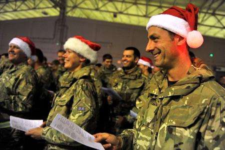 British troops enjoy a carol service at Camp Bastion, Afghanistan