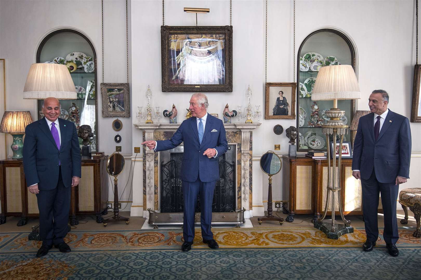 The Prince of Wales, centre, met Iraqi prime minister Mustafa al-Kadhimi, right, and Iraqi minister of foreign affairs Fuad Hussein (Victoria Jones/PA)