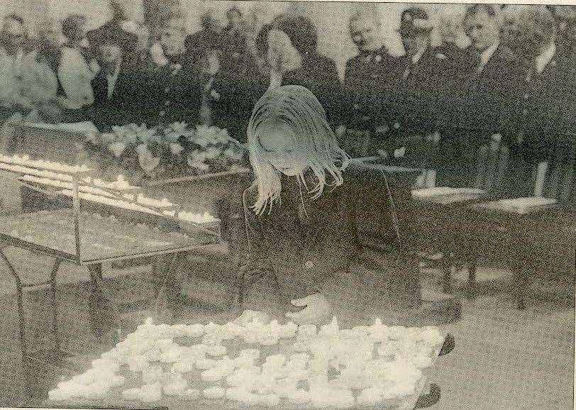 Karen Elphick lights a candle at Rochester Cathedral