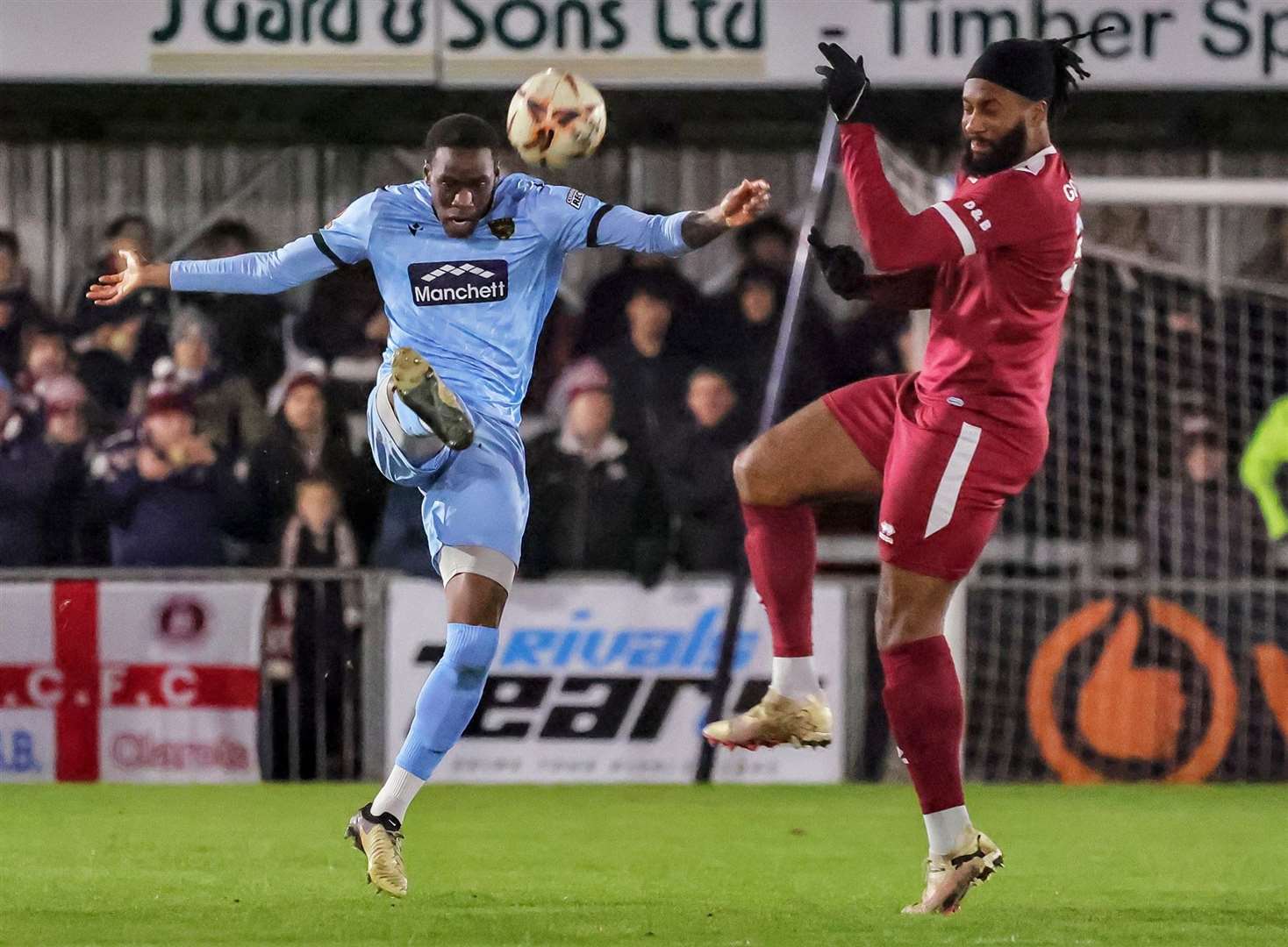 Maidstone defender Temi Eweka gets to the ball ahead of Chelmsford striker Jordan Greenidge early in the first half. Picture: Helen Cooper