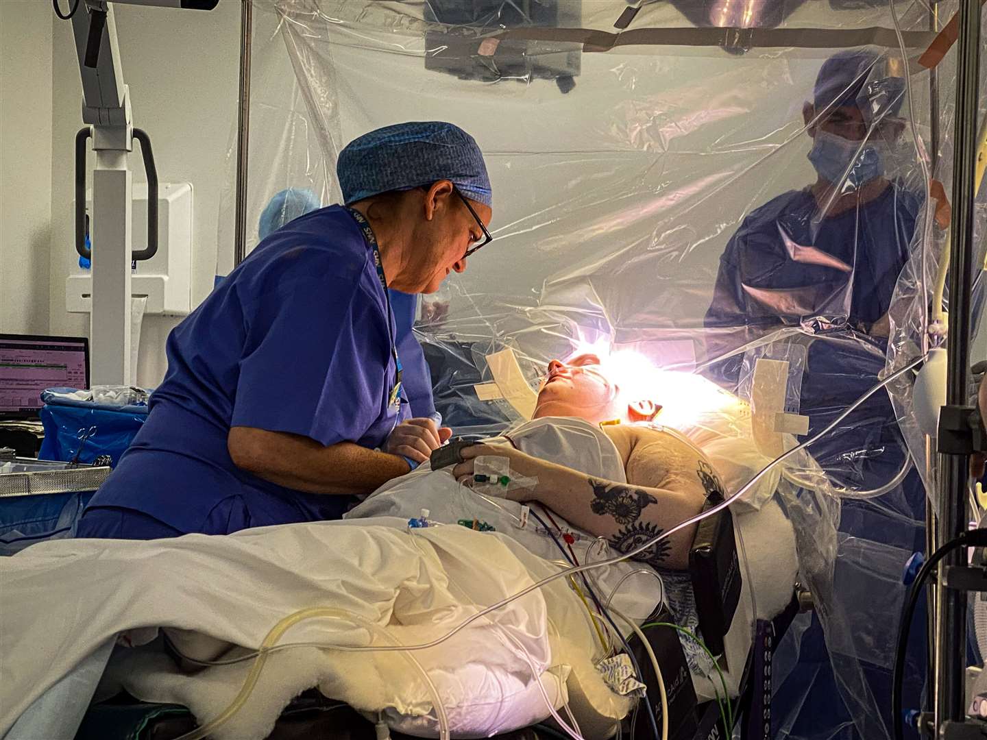 Dr Sharon Mulhern, left, supported Brooke MacFadyen during the surgery (NHS Greater Glasgow and Clyde/PA)